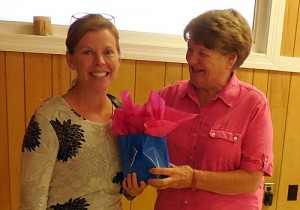 Orange County Registrar Donna Jenni accepts gift from Club Program Chairman Pat Ivey.