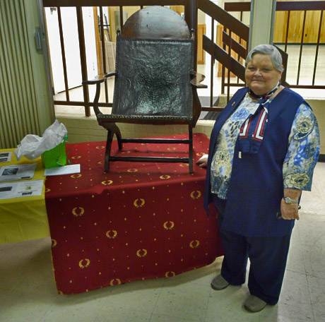 Historian Jayne Blair, The speaker, president of the Board of Directors of the James Madison Museum of Orange County Heritage, poses with James Madison's Compeche chair, which she brought to the club's March 13 program at the LOW Clubhouse.